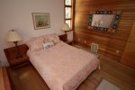 Primary bedroom on main floor with queen bed